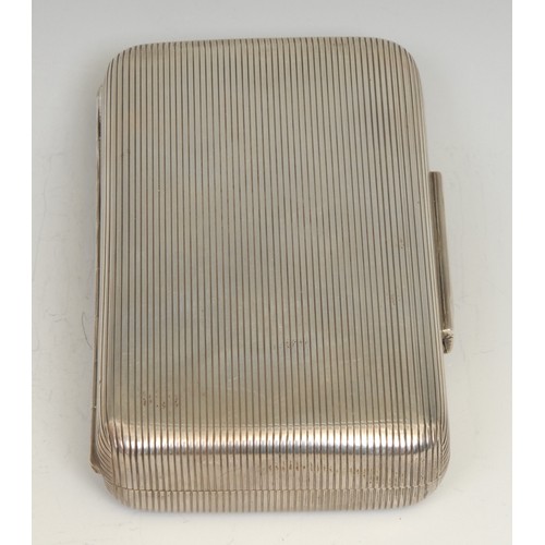 697 - A Victorian diamond set silver rounded rectangular cigar case, reeded overall, the hinged cover cent... 