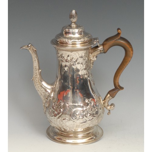 584 - A George III silver baluster coffee pot, hinged domed cover with spirally fluted knop finial, chased... 