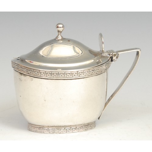 591 - A George III silver oval mustard, hinged domed cover with ball finial, Greek key borders, angular sc... 