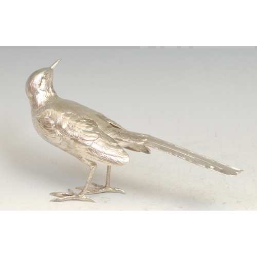 551 - A Continental cast silver novelty table decoration, a model of a bird, 17cm long, marked to tail, ea... 