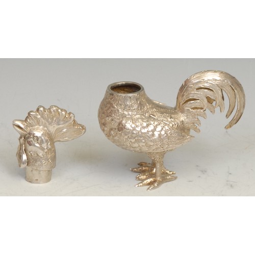 557 - A Continental silver novelty condiment canister, as a cockerel, articulated wings, 9cm long, marked ... 