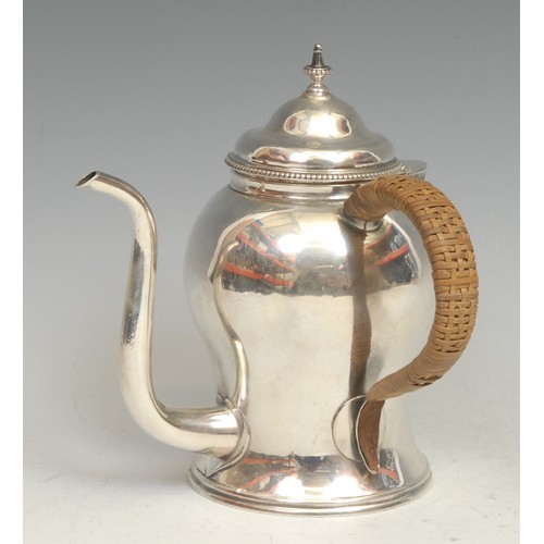 590 - A George III silver ogee argyle, domed cover, S-shaped spout, beaded borders, wicker-wrapped handle,... 