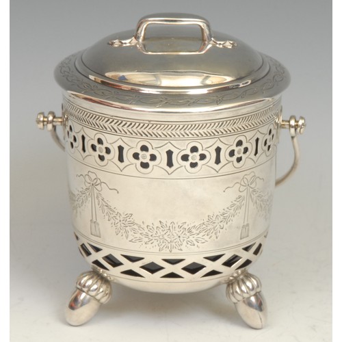 819 - An unusual Victorian silver swing-handled sugar or preserve basket and cover, bright-cut and wriggle... 