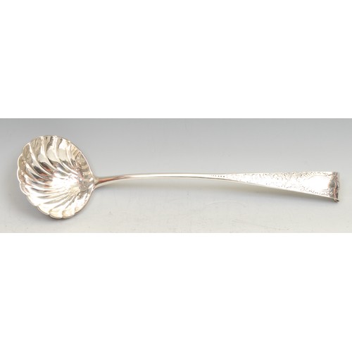 497 - A George III Irish silver Old English pattern soup ladle, shell bowl, chased stem, 36cm long, Dublin... 