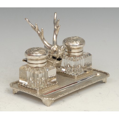 545 - A Chinese silver rectangular inkstand, centred by a deer flanked by a pair of square glass wells, on... 