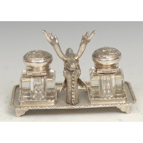 545 - A Chinese silver rectangular inkstand, centred by a deer flanked by a pair of square glass wells, on... 