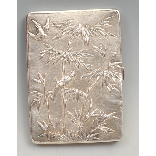 546 - A Chinese silver rectangular visiting card case, chased with figures in a landscape of pines and pru... 