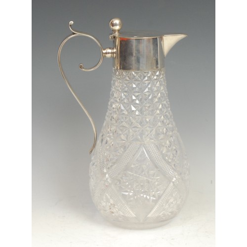 556 - A Continental silver mounted hobnail cut glass claret jug, hinged cover with ball thumbpiece, scroll... 