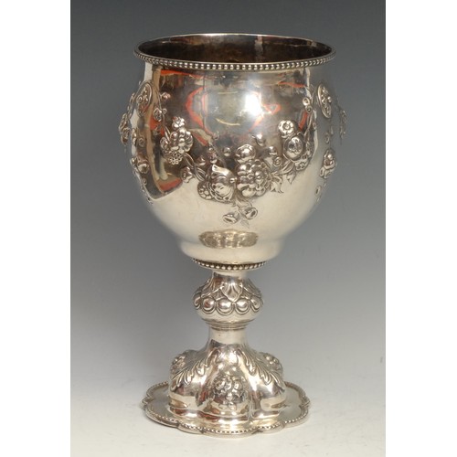 833 - Hunting & Horse Racing - a large Victorian silver presentation goblet, chased with flowers and leave... 