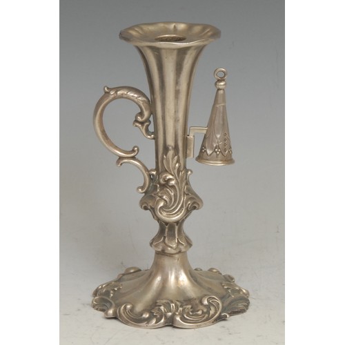 766 - An early Victorian Rococo Revival silver chamberstick, fluted and chased with a border of leafy scro... 