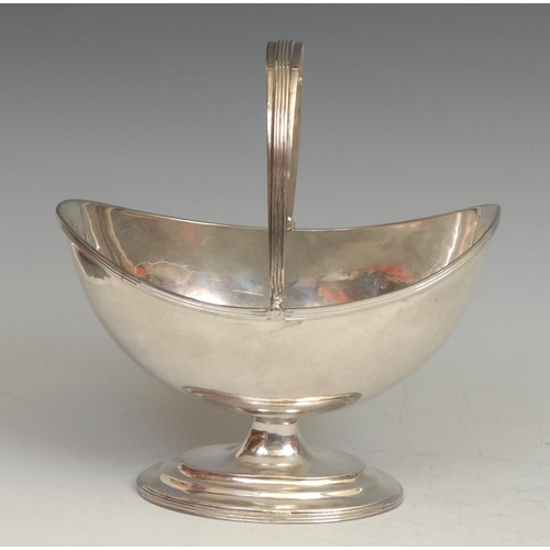 831 - Hester Bateman - a George III oval pedestal swing-handled sugar basket, quite plain, reeded borders,... 