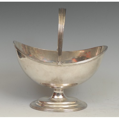 831 - Hester Bateman - a George III oval pedestal swing-handled sugar basket, quite plain, reeded borders,... 