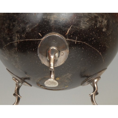 743 - An 18th century silver coloured metal mounted coconut cup, pad feet, 11.5cm high, c.1760