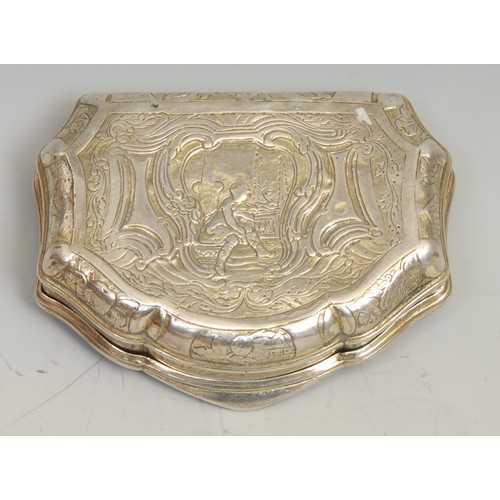 739 - An 18th century Continental silver serpentine snuff box, chased in the Rococo taste with figures fro... 