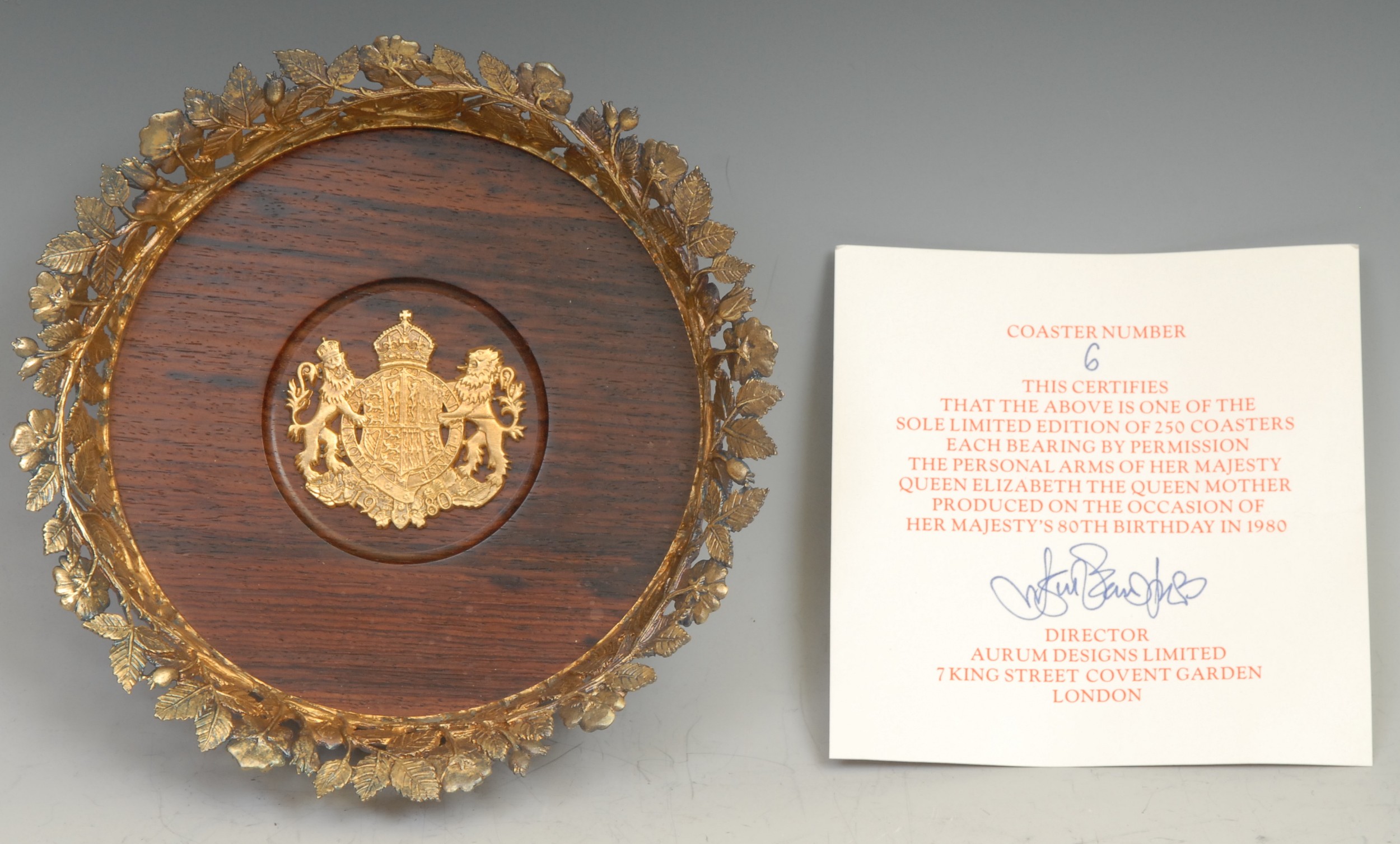 An Elizabeth II silver gilt wine coaster commemorative of the