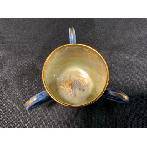 11 - A Wedgwood Dragon lustre miniature three-handled loving cup/Tyg, designed by Daisy Makeig-Jones, pri... 