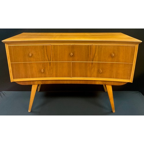 66 - An Alfred Cox style, mid century design walnut and beech Dressing table, inverted bow-front, three s... 