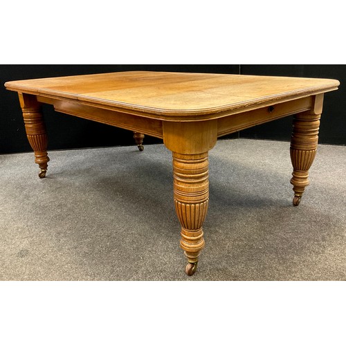 90 - A Victorian oak extending dining table, rounded rectangular top, with single additional leaf, large ... 