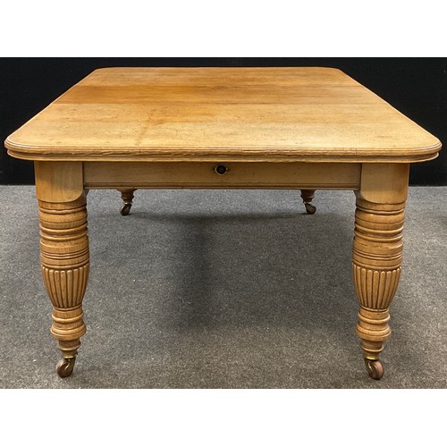 90 - A Victorian oak extending dining table, rounded rectangular top, with single additional leaf, large ... 