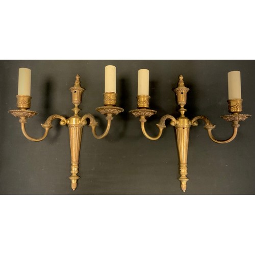 95 - A pair of brass two branch wall lights, 36.5cm high, 31cm wide.