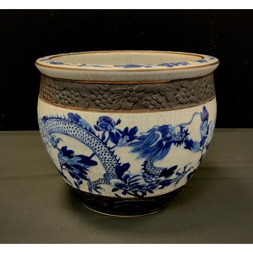 99 - A Chinese blue and white crackled planter, 22cm high, 27cm diameter.