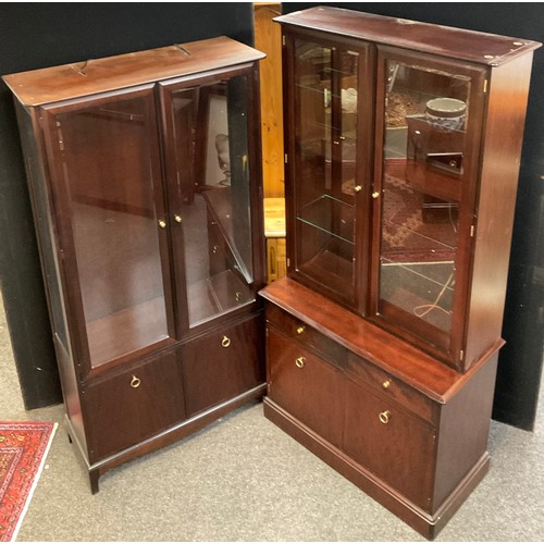 112 - A Stagg Minstrel two door display cabinet, 3/4 length glazed doors over pair of cupboard doors, 181c... 