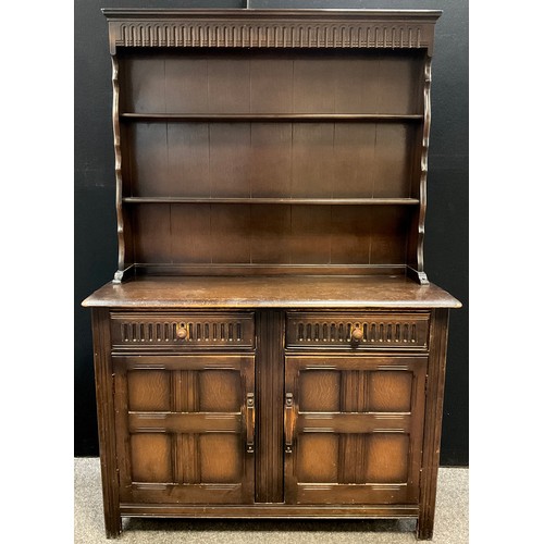 113 - A Priory dark oak dresser, 179.5cm high x 122cm x 46cm, mid 20th century.