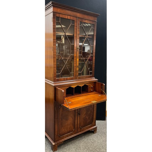 144 - A George III style mahogany Secretaire bookcase, dentil cornice, astral-glazed doors enclosing two t... 