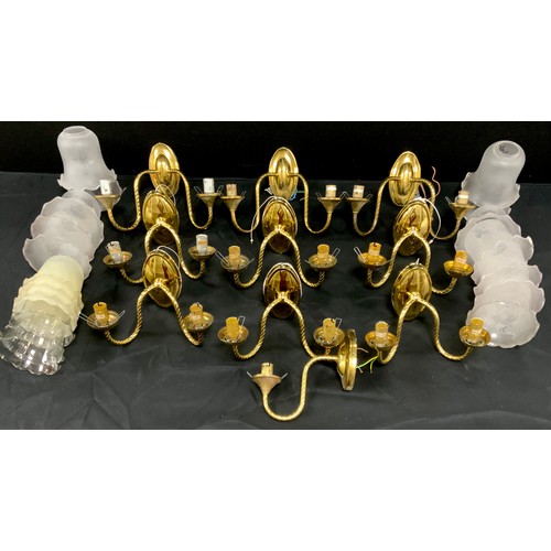 203 - A set of six two branch brass light fixtures, four extra similar, conforming light shades, 16cm high