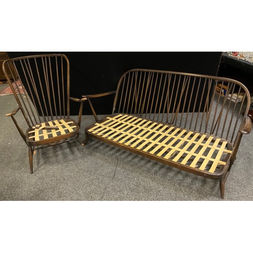 260 - An Ercol three seat sofa, 81cm high x 177cm wide x 90cm deep; conforming armchair, (2).