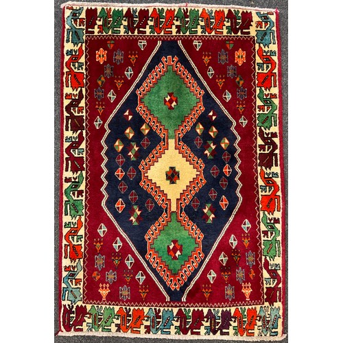 264 - A South-west Persian Qashgai rug, hand-knotted with a central row of three diamond-shaped medallions... 