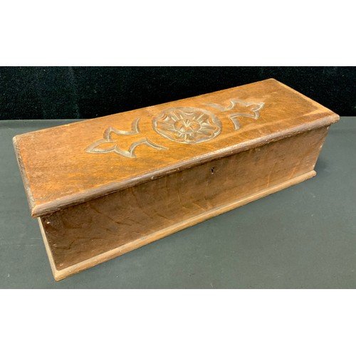 266 - A late 19th century oak rectangular candle box, the hinged cover carved with a Yorkshire rose, 46cm ... 