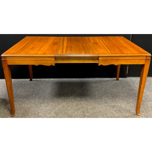 254 - A mid-20th century walnut dining room suite, by Waring & Gillow, comprising extending dining table w... 