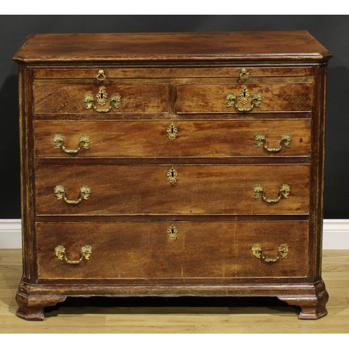 2228 - A George III mahogany bachelors chest, of canted rectangular form, oversailing top above a brushing ... 