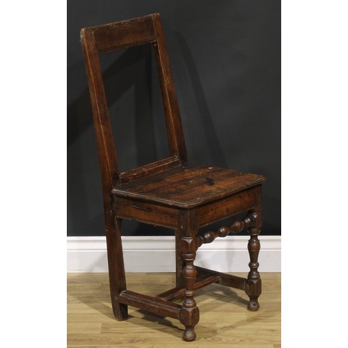 1227 - A harlequin pair of 18th century oak backstools, boarded seats, H-stretchers, the largest 85.5cm hig... 