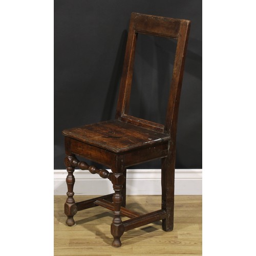 1227 - A harlequin pair of 18th century oak backstools, boarded seats, H-stretchers, the largest 85.5cm hig... 