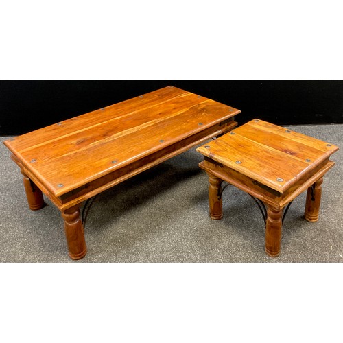 301 - An exotic hardwood and metalwork coffee table, rectangular top, turned legs with decorative ‘forged’... 