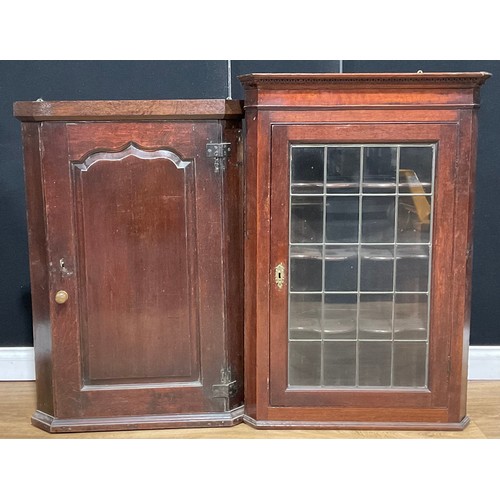 307 - A George III oak corner cupboard, raised and fielded panel door, 99cm high; others (4)