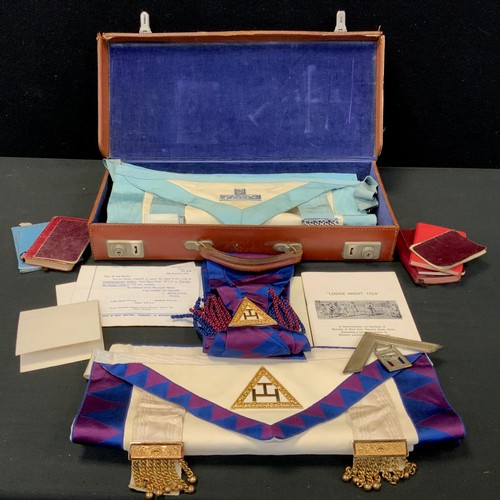 334 - A 1970s Masonic case with aprons, sashes, books etc