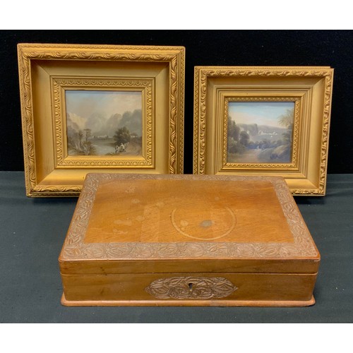 365 - A 20th century carved rectangular trinket box, 28cm long, two oil paintings of Devon on board in gil... 