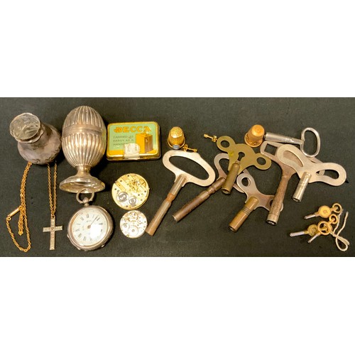 389 - A silver pepper; a silver fob watch; a Decca gramophone needle tin; clock keys; etc