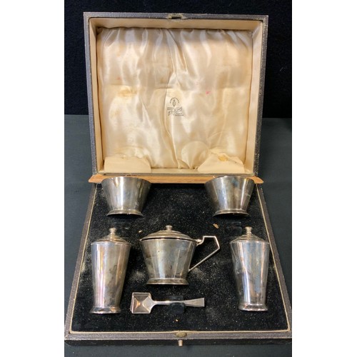 398 - An Art Deco silver five piece condiment set, pair of open salts, pair of pepperettes and lidded must... 