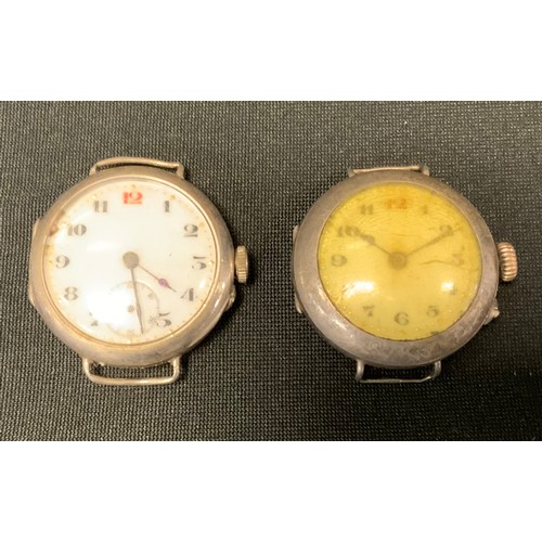 400 - An early 20th century silver trench watch, import mark for London 1919; another, London 1915 (2)