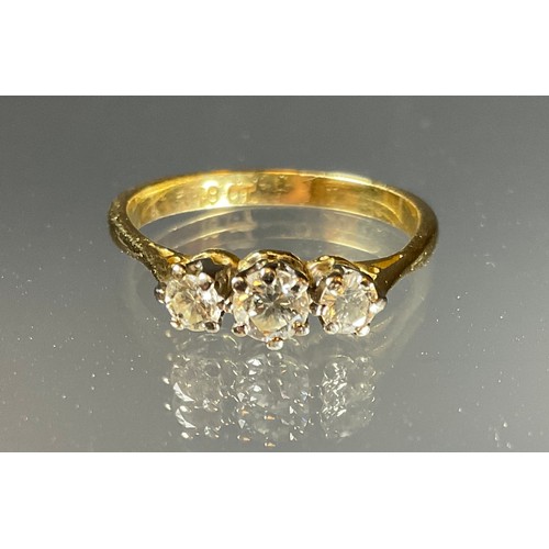 413 - A diamond ring, linear set with three round old brilliant cut diamonds, estimated total diamond weig... 