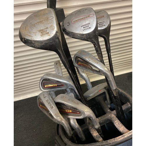 310 - Golfing - a set of Howson Enforcer golf clubs, Hippo golf bag, folding two wheeled cart carrier.