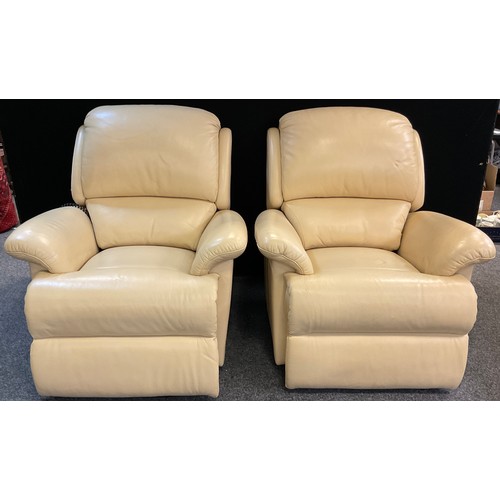 263A - A pair of Sherborne electric recliner armchairs, in cream ‘leather’ upholstery, (2).