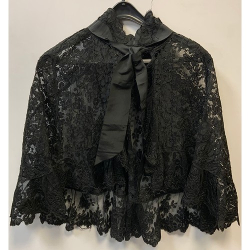 195A - A Victorian black lace shoulder piece/cape all over decorated with floral vines and panels, jet styl... 