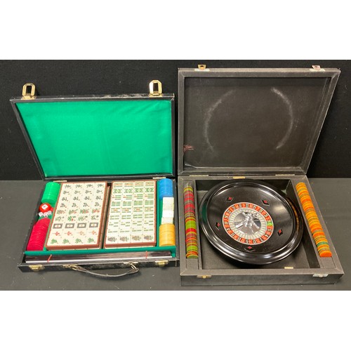 120A - Games - a cased K & C London roulette set with metal wheel, assorted chip counters;  cased and seale... 