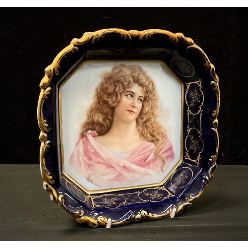 269A - A 20th century continental porcelain canted square bowl, decorsated with a portrait of a curly raven... 