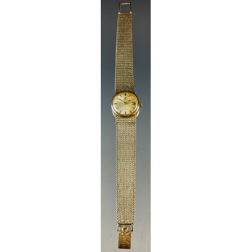 17 - Omega - a lady's 1061 automatic 9ct gold cased bracelet watch, silvered dial, block baton markers, c... 